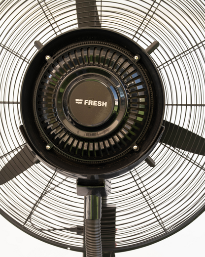 Close-up of a ceiling fan with 'FRESH' branding on the motor housing.