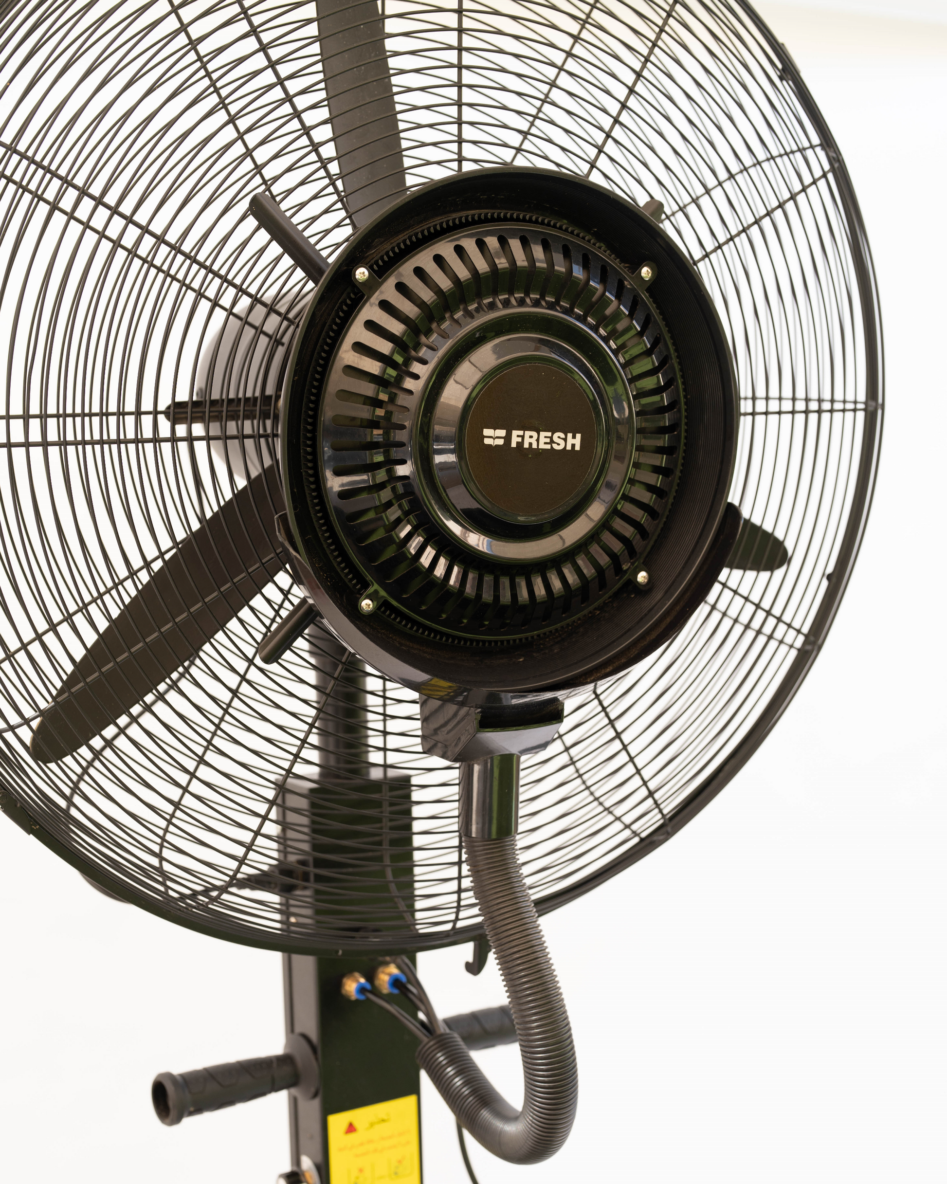 Black outdoor fan with visible brand name on a white background